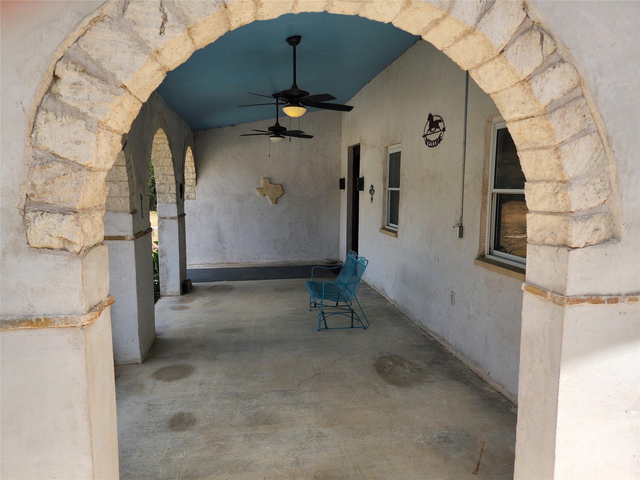 500 Spring Creek Road Florence, TX 76527 - Photo 11 of 38 Side view of the huge from covered porch.