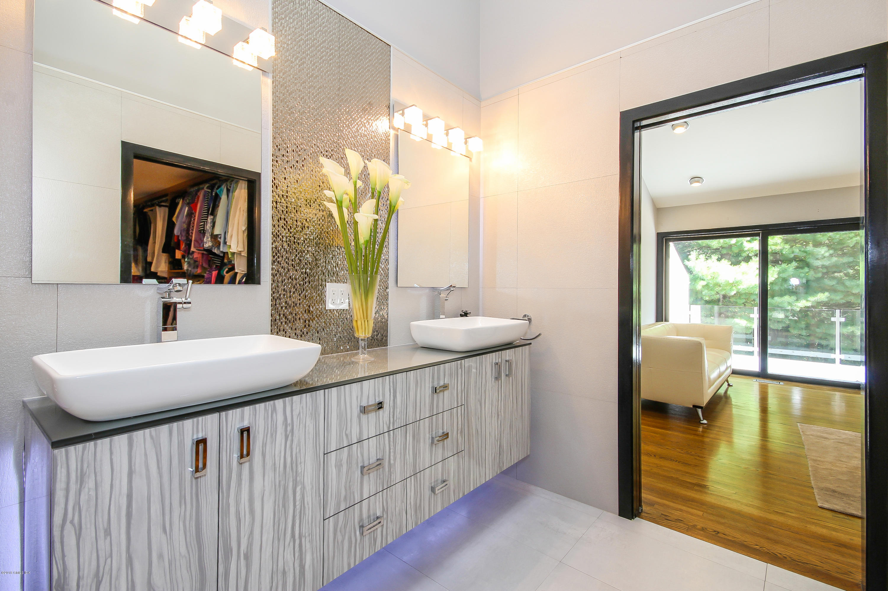 106 Porchuck Road Greenwich, CT 06831 - Photo 13 of 37 a bathroom with a double vanity sink and a mirror