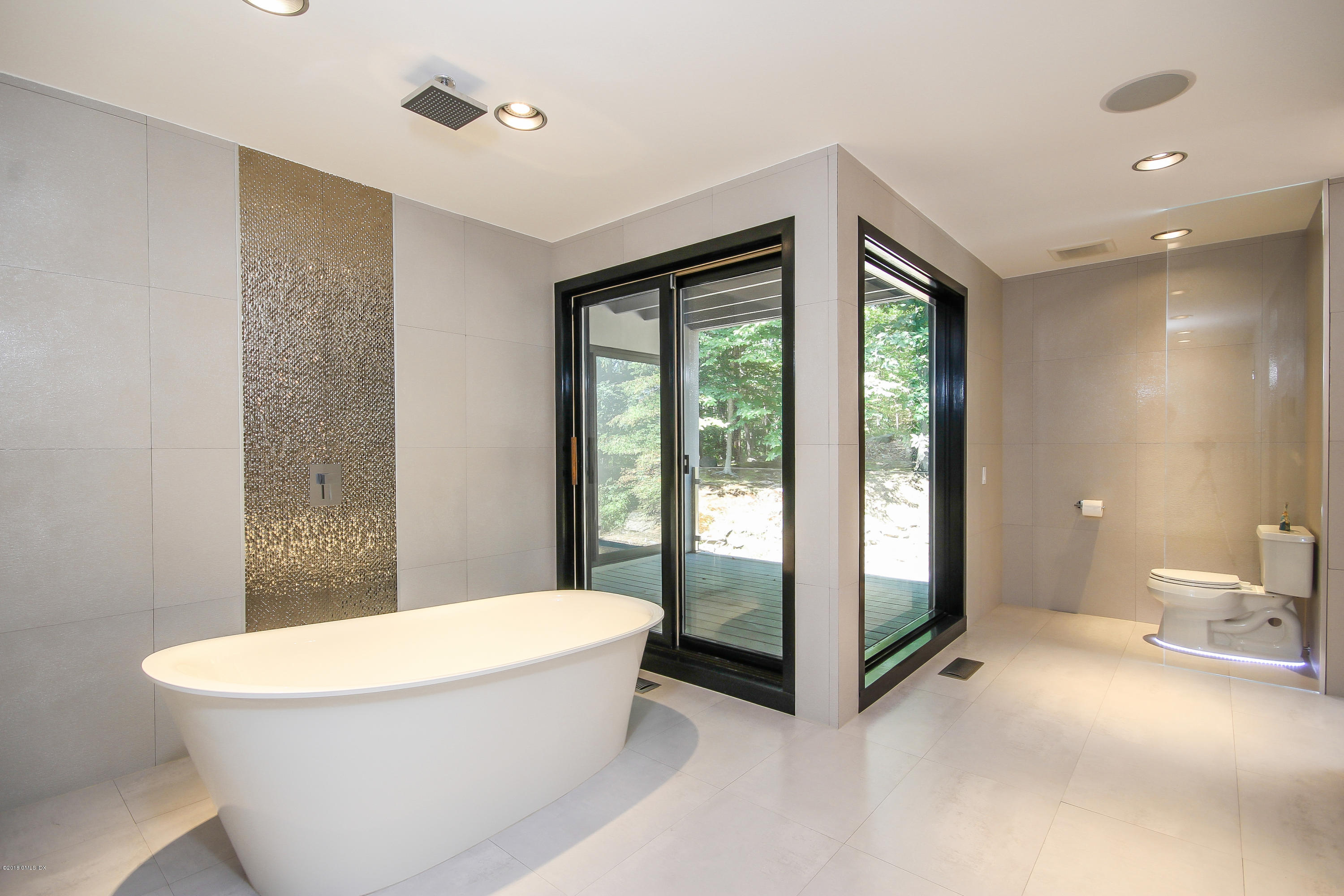 106 Porchuck Road Greenwich, CT 06831 - Photo 15 of 37 a bathroom with a bathtub and a shower