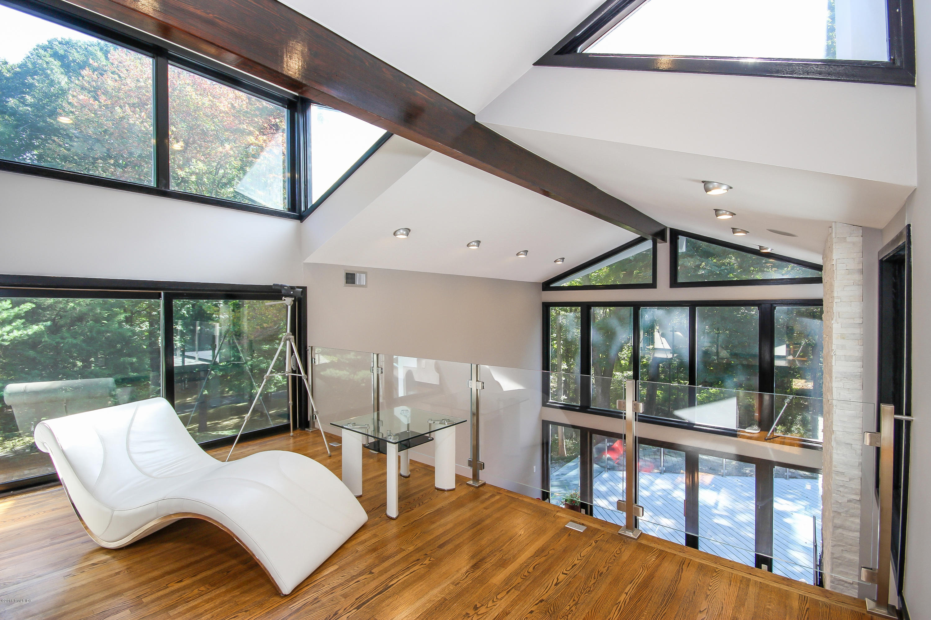 106 Porchuck Road Greenwich, CT 06831 - Photo 16 of 37 a living room with furniture and a large window
