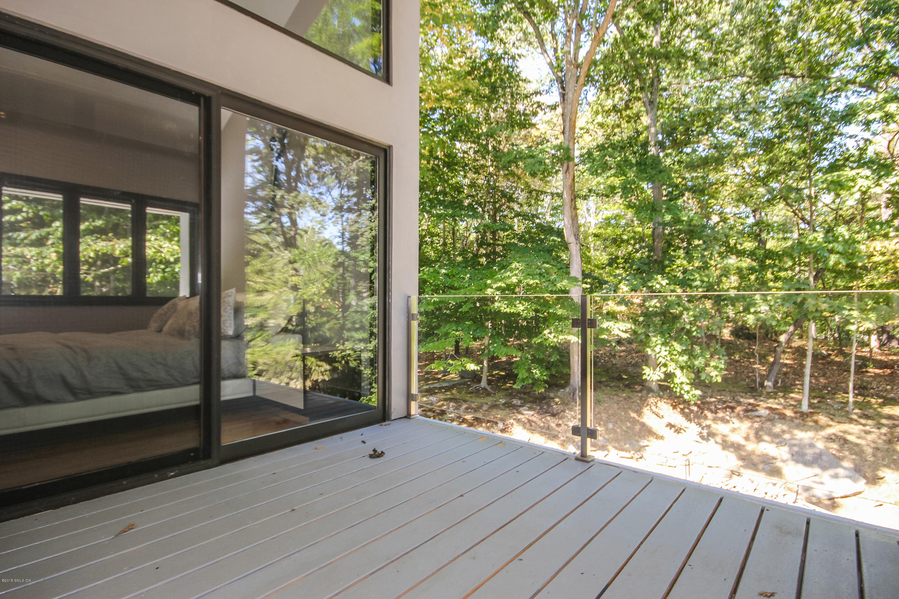 106 Porchuck Road Greenwich, CT 06831 - Photo 21 of 37 a view of a room with wooden floor and outdoor space