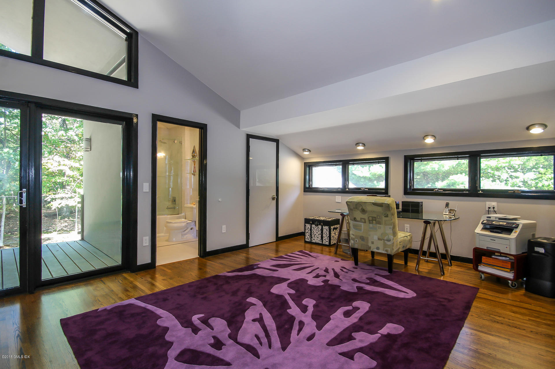 106 Porchuck Road Greenwich, CT 06831 - Photo 22 of 37 a bedroom with a bed and large windows