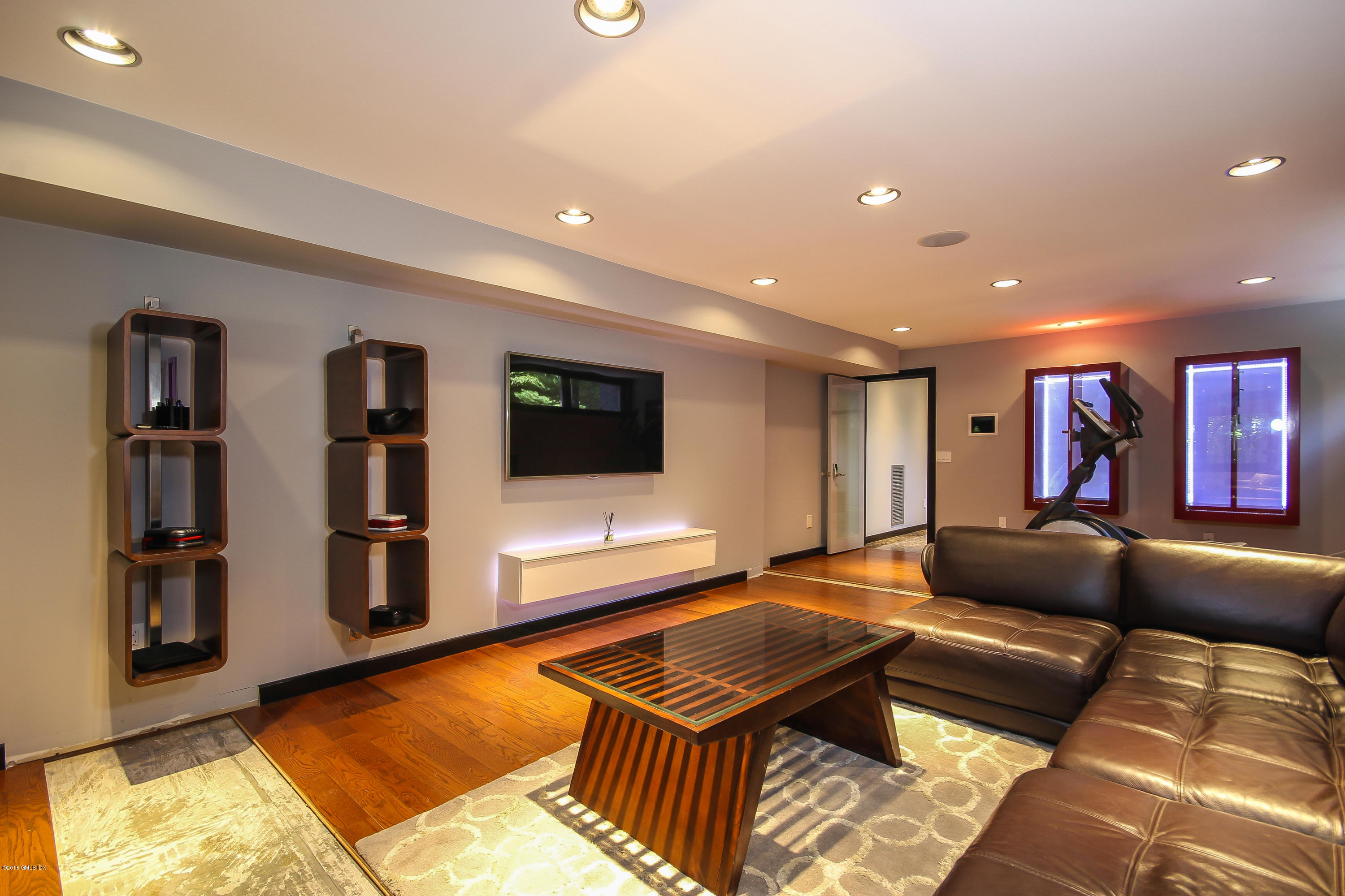 106 Porchuck Road Greenwich, CT 06831 - Photo 26 of 37 a living room with furniture and a flat screen tv