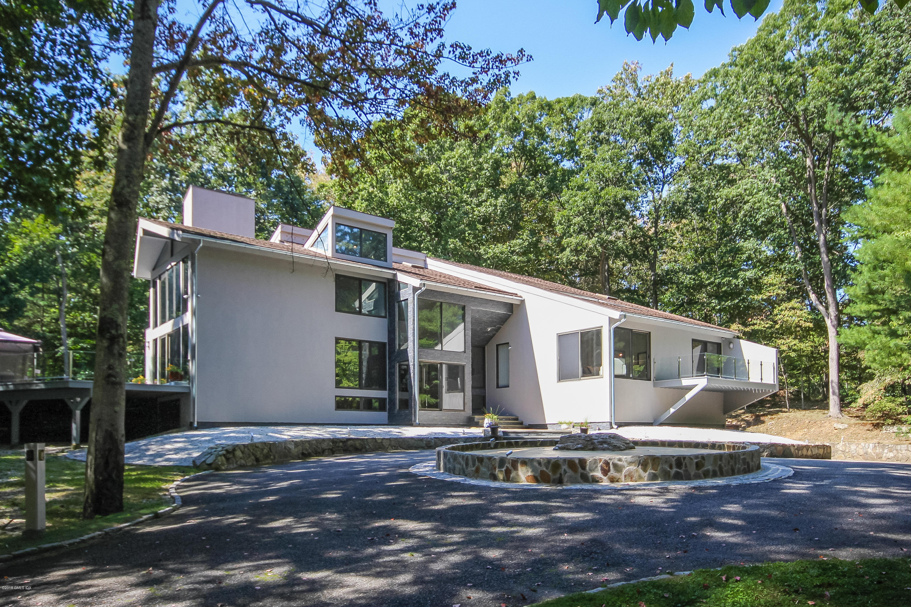 106 Porchuck Road Greenwich, CT 06831 - Photo 3 of 37 a view of a house with backyard and sitting area