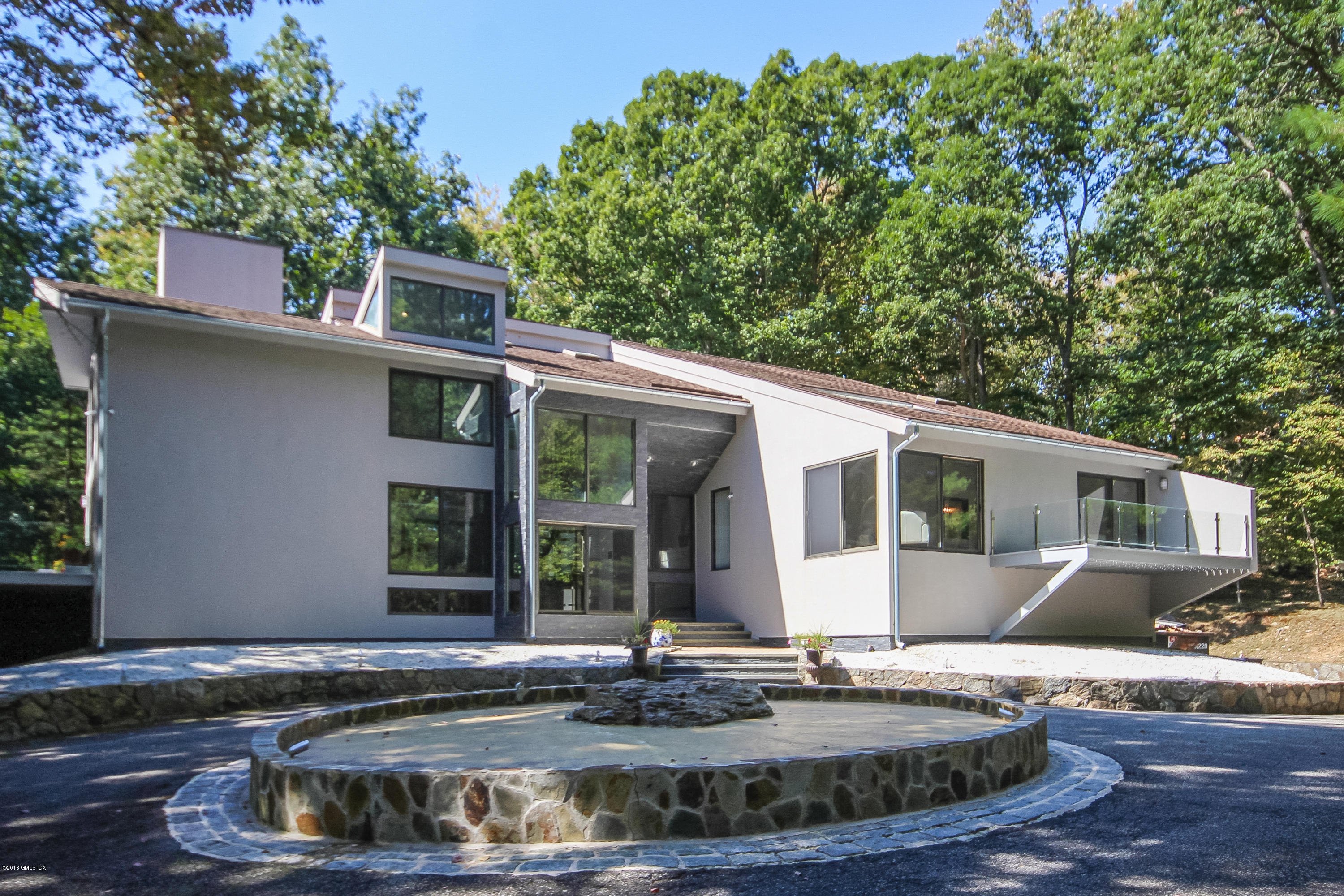 106 Porchuck Road Greenwich, CT 06831 - Photo 31 of 37 a view of a house with yard and sitting area