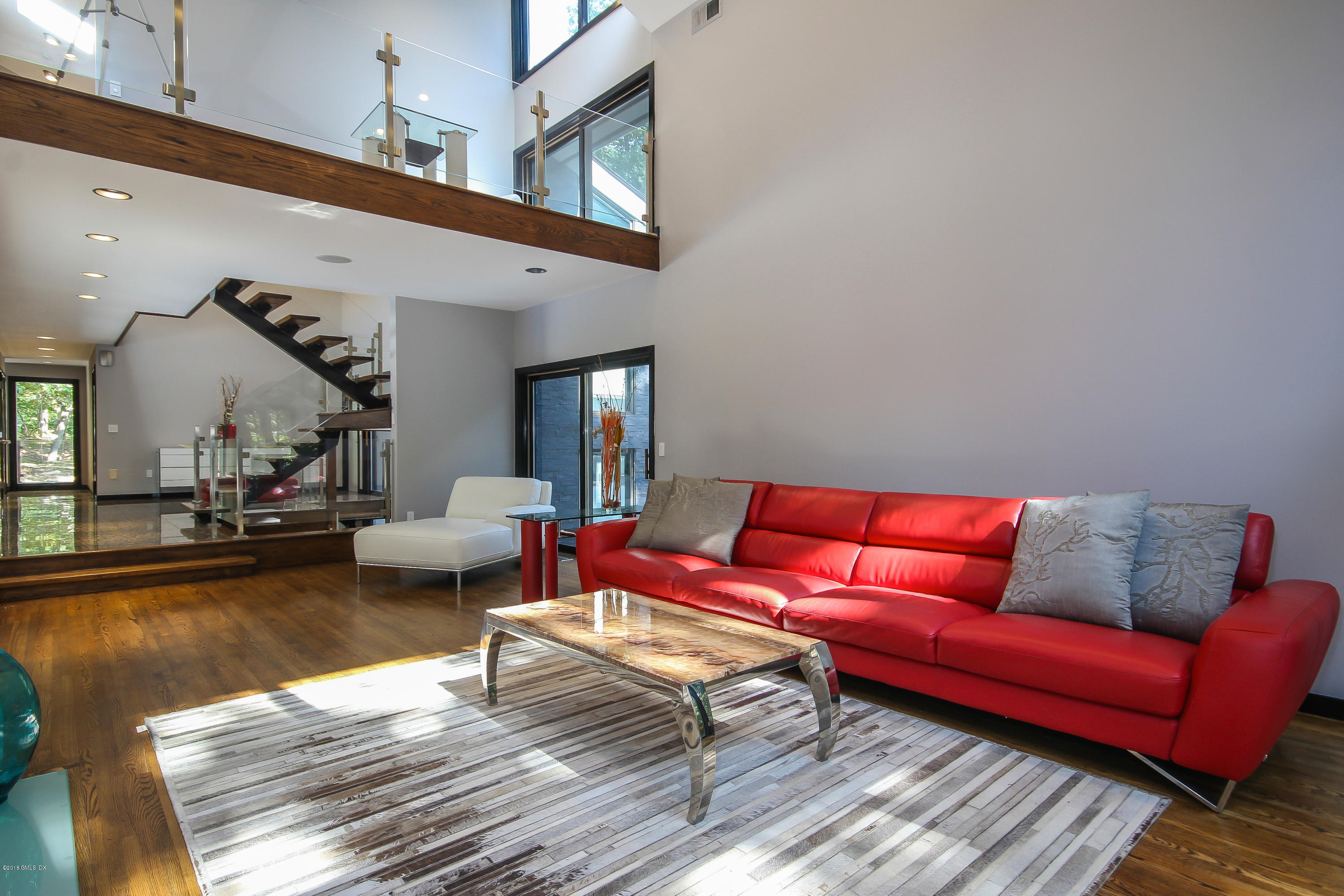 106 Porchuck Road Greenwich, CT 06831 - Photo 4 of 37 a living room with furniture and a couch