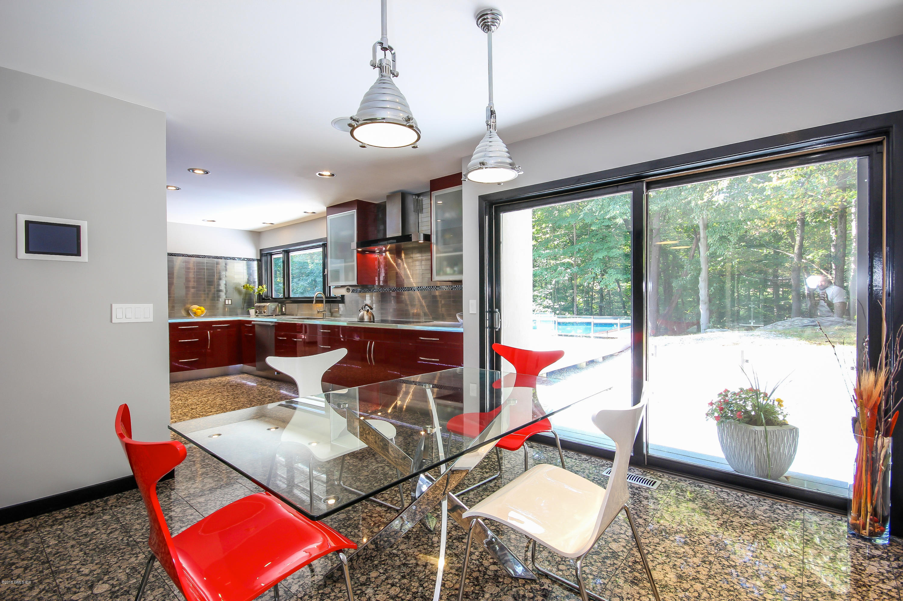 106 Porchuck Road Greenwich, CT 06831 - Photo 6 of 37 a living room with a floor to ceiling window and wooden floor