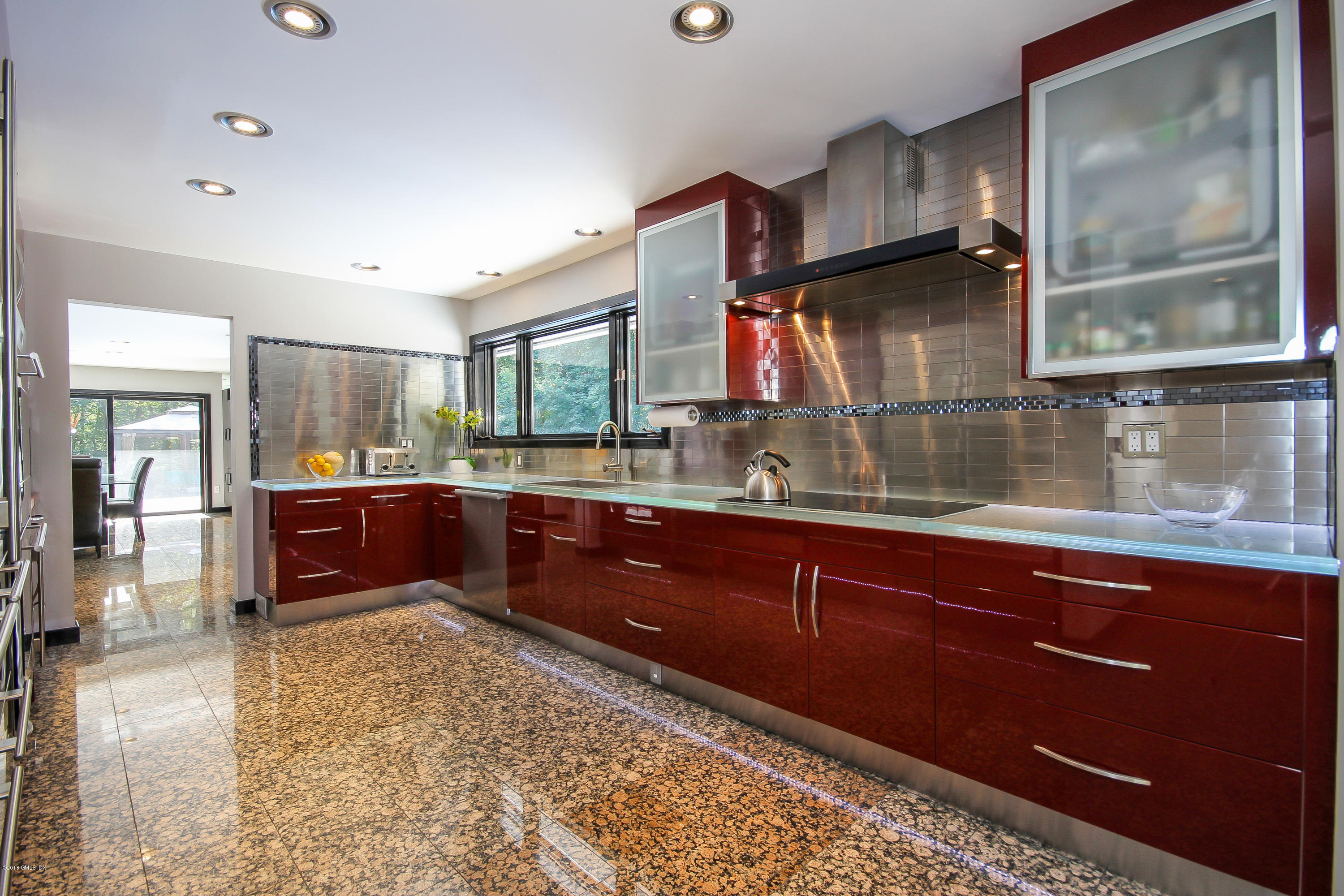 106 Porchuck Road Greenwich, CT 06831 - Photo 7 of 37 a kitchen with stainless steel appliances granite countertop a sink stove and cabinets