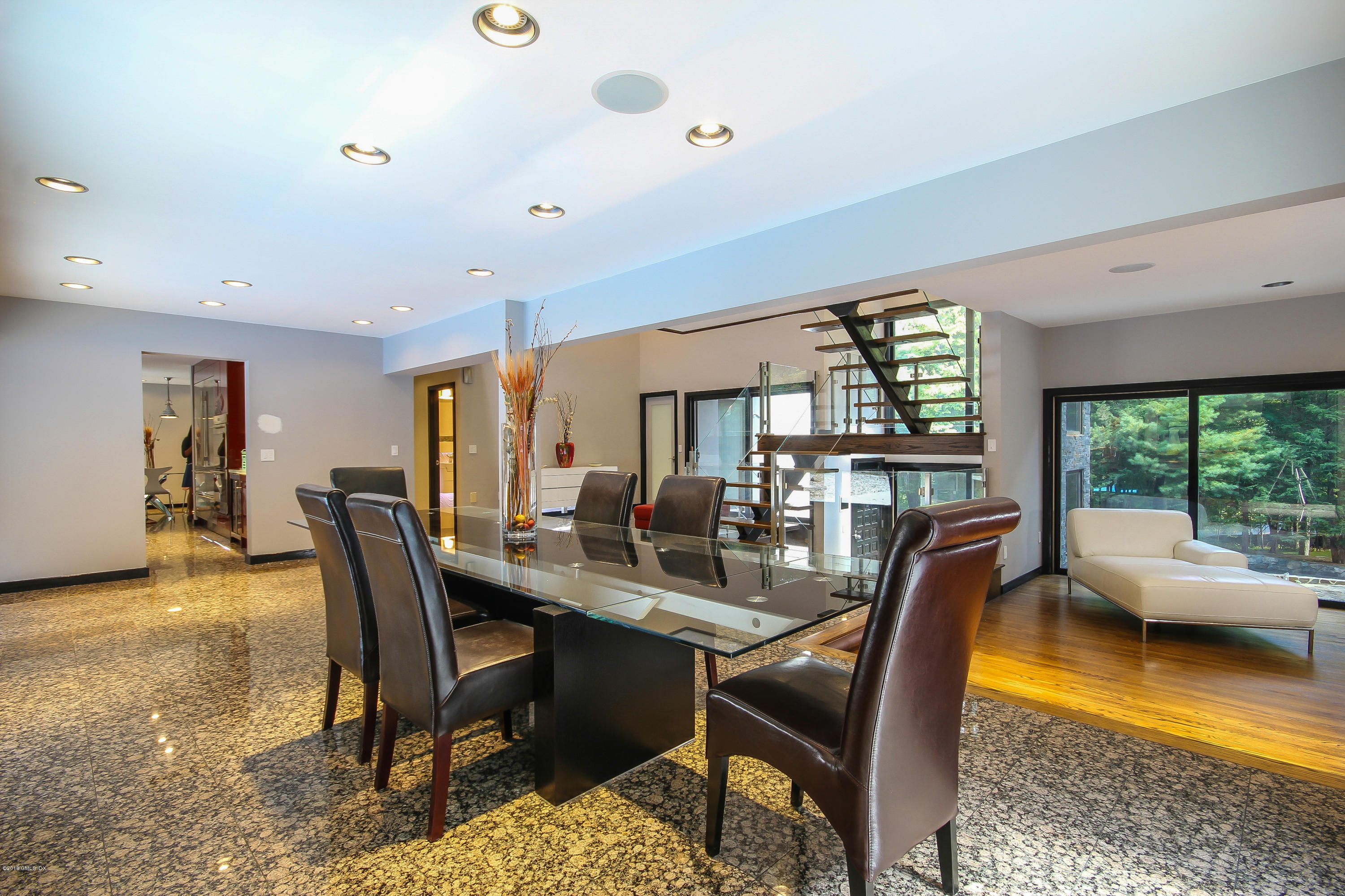 106 Porchuck Road Greenwich, CT 06831 - Photo 9 of 37 a dining room with furniture and a floor to ceiling window