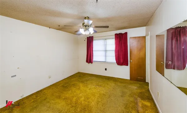 a view of an empty room with window