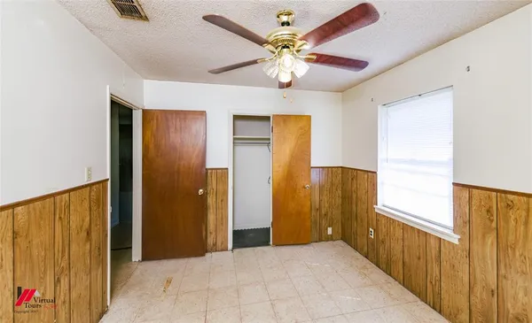 a view of entryway with a chandelier fan