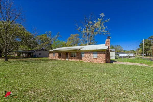 a view of a house with a big yard