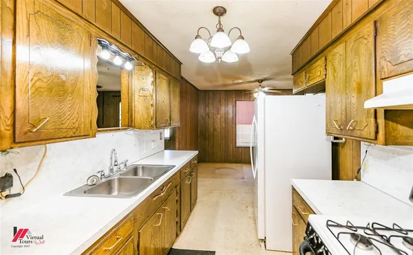 a bathroom with a sink a vanity and a mirror