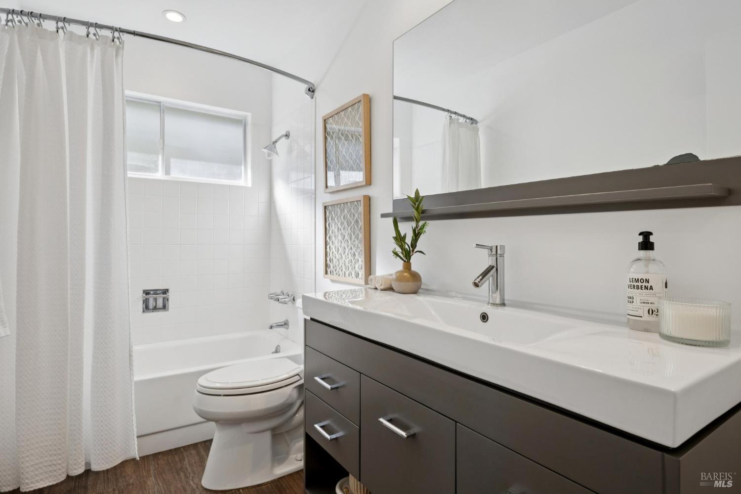 81 Rose Street San Rafael, CA 94901 - Photo 49 of 67 a bathroom with a sink a toilet and shower