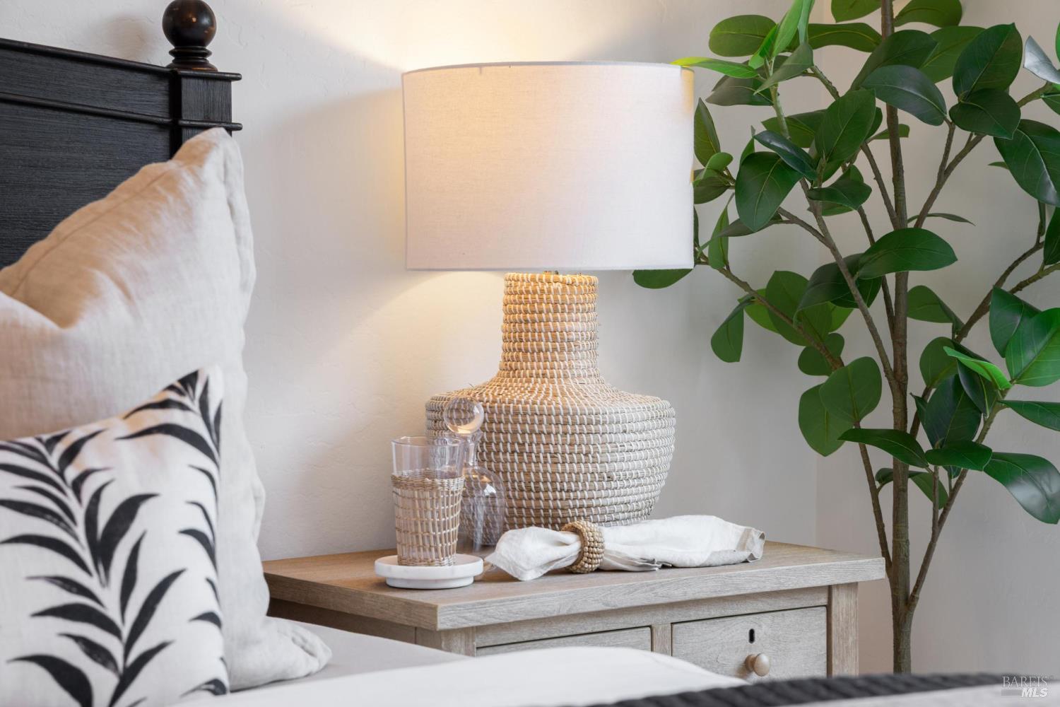 81 Rose Street San Rafael, CA 94901 - Photo 56 of 67 a vase of flowers sitting on a table with six mirrors