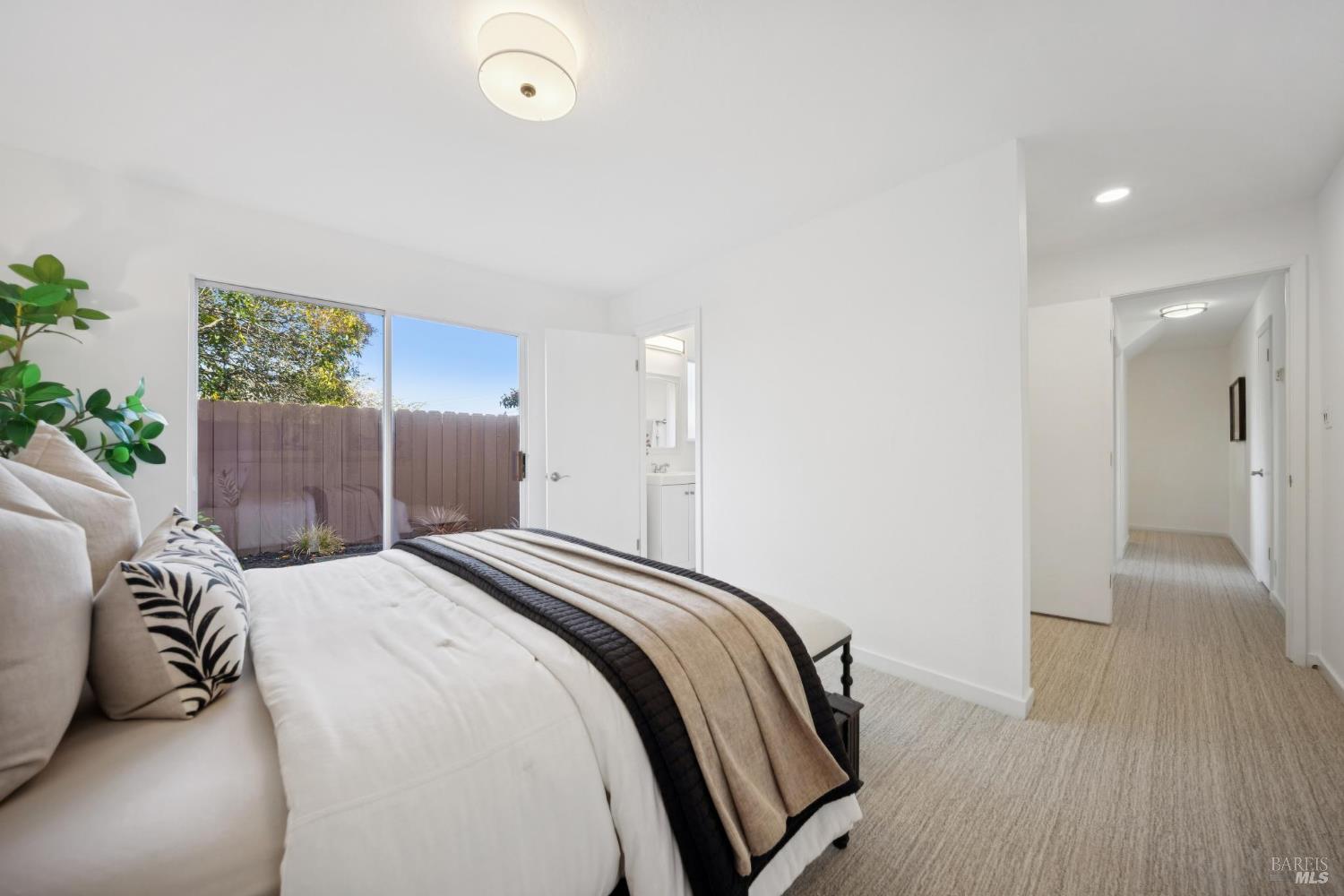 81 Rose Street San Rafael, CA 94901 - Photo 57 of 67 a bedroom with a bed and a wooden floor