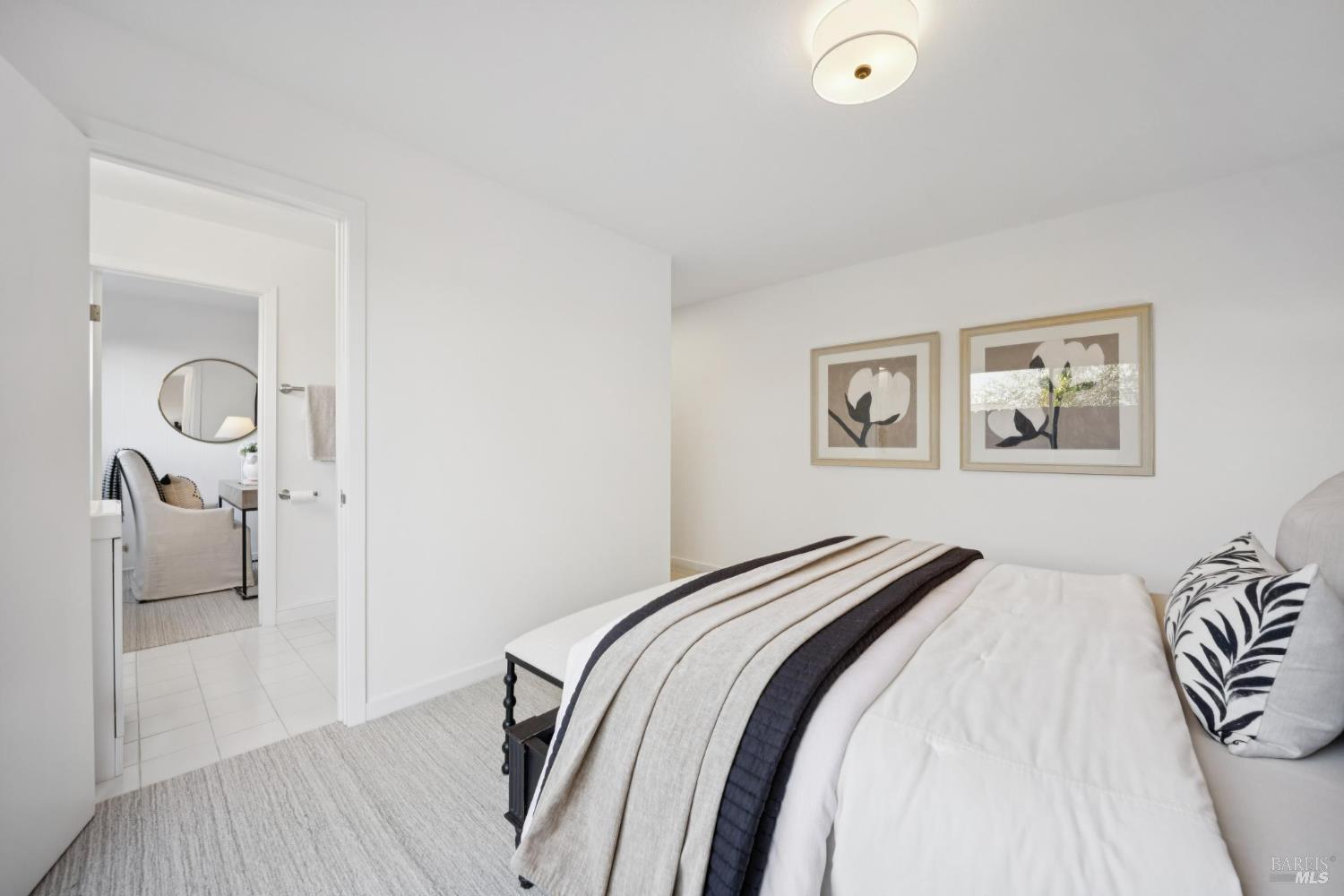 81 Rose Street San Rafael, CA 94901 - Photo 60 of 67 a bedroom with a bed and a chandelier