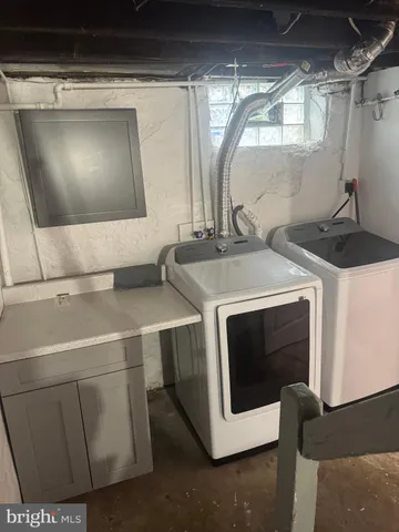 a utility room with washer and dryer