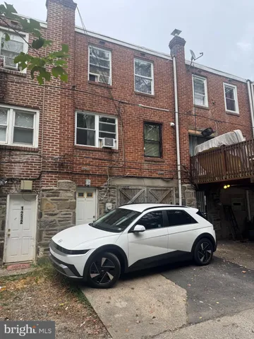 a view of a car parked in front of a building