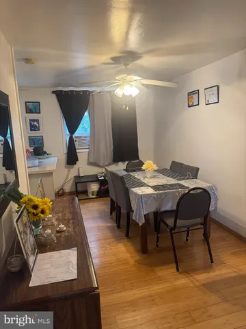 a view of a dining room with furniture and a rug