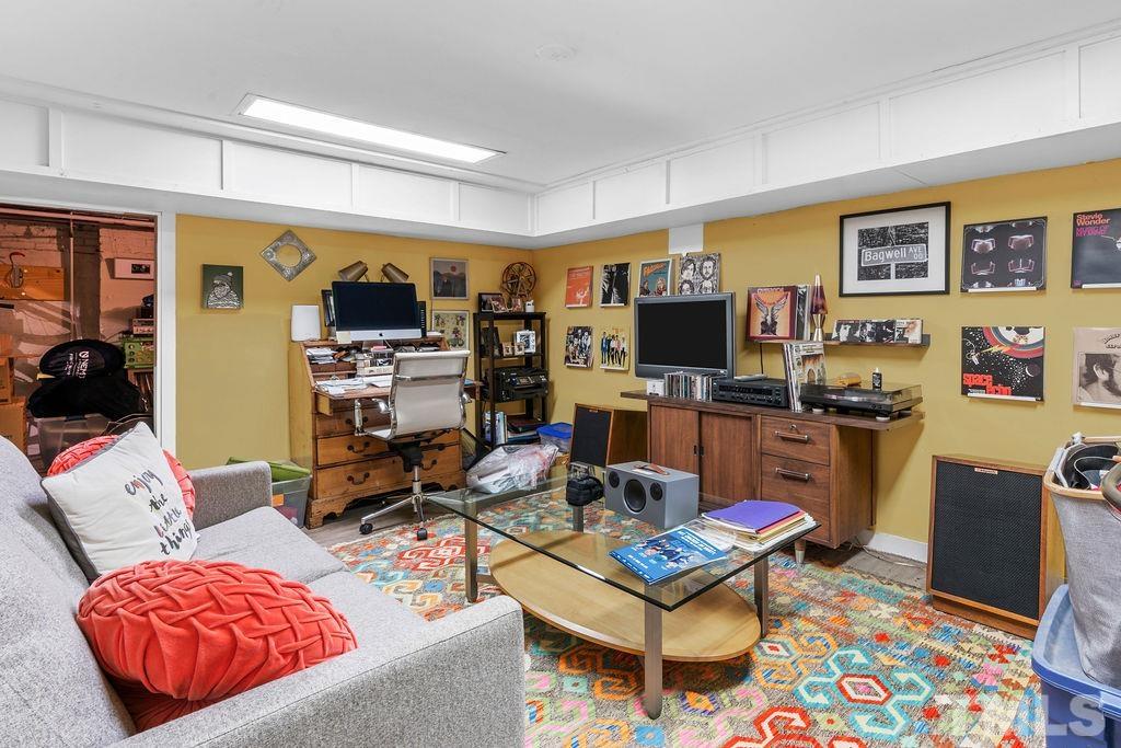 116 Hillcrest Road Raleigh, NC 27605 - Photo 15 of 30 a living room with furniture and a flat screen tv