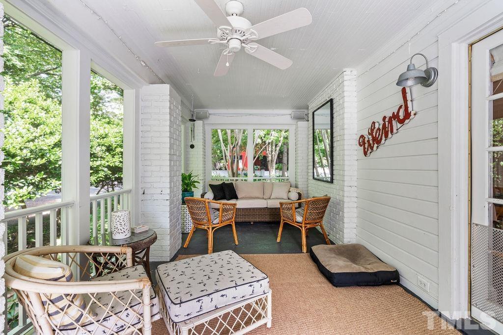 116 Hillcrest Road Raleigh, NC 27605 - Photo 16 of 30 a living room with furniture and a large window