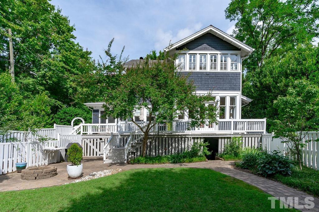 116 Hillcrest Road Raleigh, NC 27605 - Photo 19 of 30 a front view of a house with a garden and plants