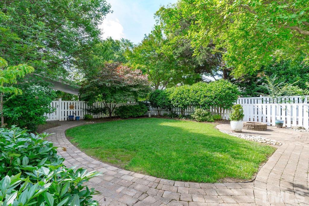 116 Hillcrest Road Raleigh, NC 27605 - Photo 20 of 30 a view of a garden with a bench