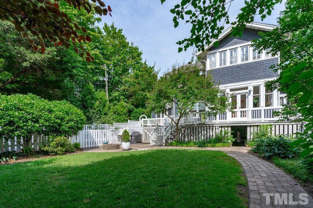 116 Hillcrest Road Raleigh, NC 27605 - Photo 21 of 30 a front view of a house with a garden and plants