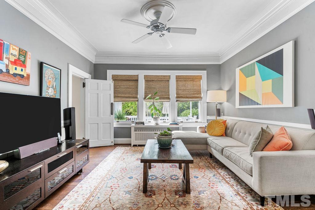 116 Hillcrest Road Raleigh, NC 27605 - Photo 7 of 30 a living room with furniture and a flat screen tv