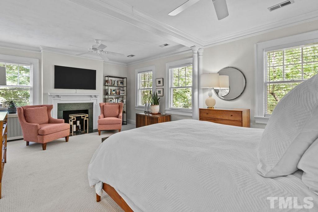116 Hillcrest Road Raleigh, NC 27605 - Photo 10 of 30 a living room with furniture a flat screen tv and a fireplace