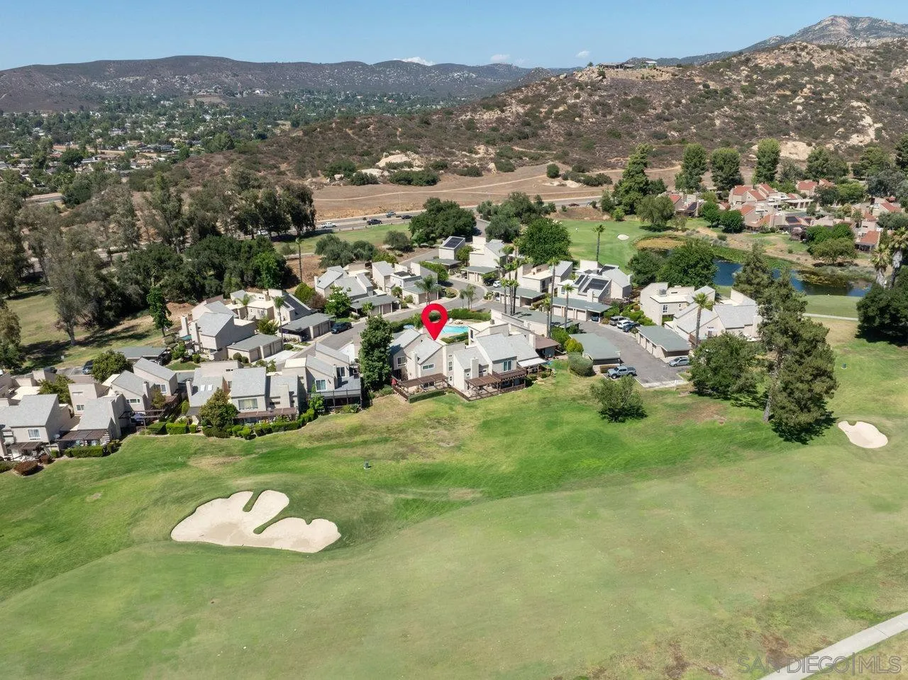 a view of a town with mountains in the background