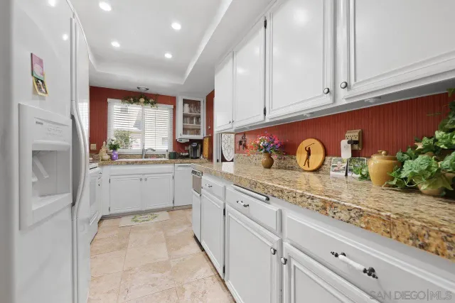 a bedroom with a bed and cabinets