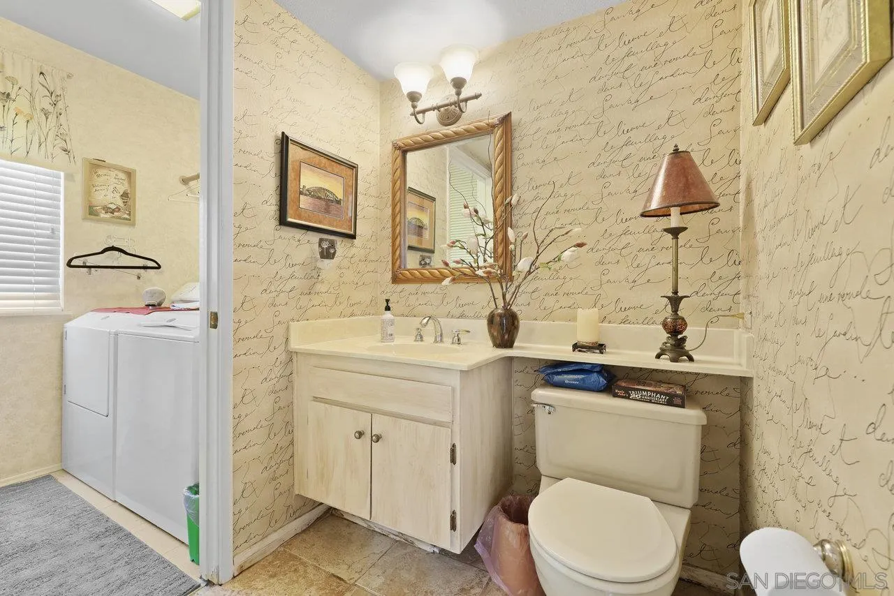 23653 Country Villa Road Ramona, CA 92065 - Photo 30 of 51 a bathroom with a toilet sink and mirror