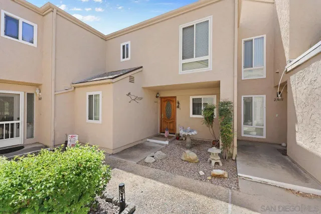 a living room with furniture large window and flat screen tv