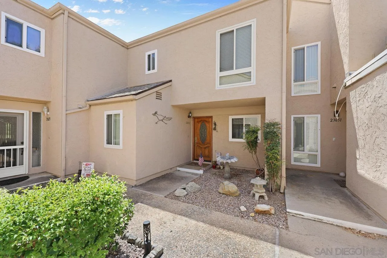 23653 Country Villa Road Ramona, CA 92065 - Photo 3 of 51 a front view of a house with a yard