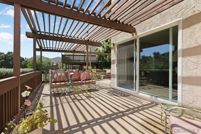 a view of a patio with wooden floor