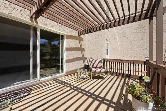 a view of an outdoor sitting area with furniture