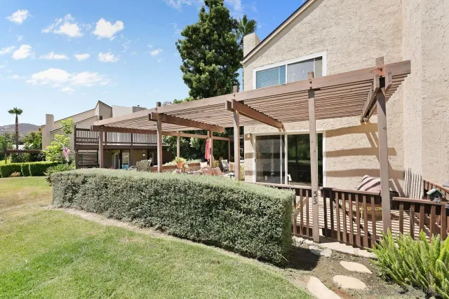 a view of a street with potted plants