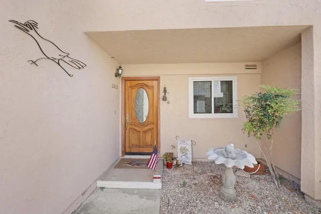 an aerial view of a house with a garden and swimming pool