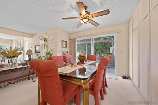 a kitchen with granite countertop cabinets stainless steel appliances and a counter space