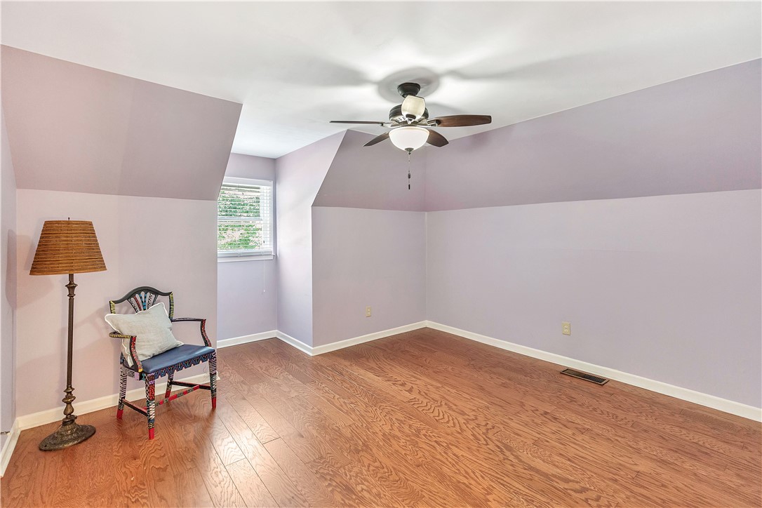 910 Chantilly Lane Anderson, SC 29625 - Photo 18 of 38 Natural light illuminates rich hardwood floors within this adaptable bedroom space.