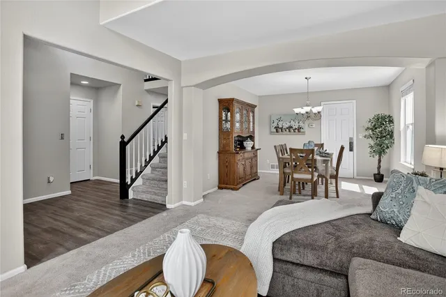 a room with furniture pool table and a flat screen tv
