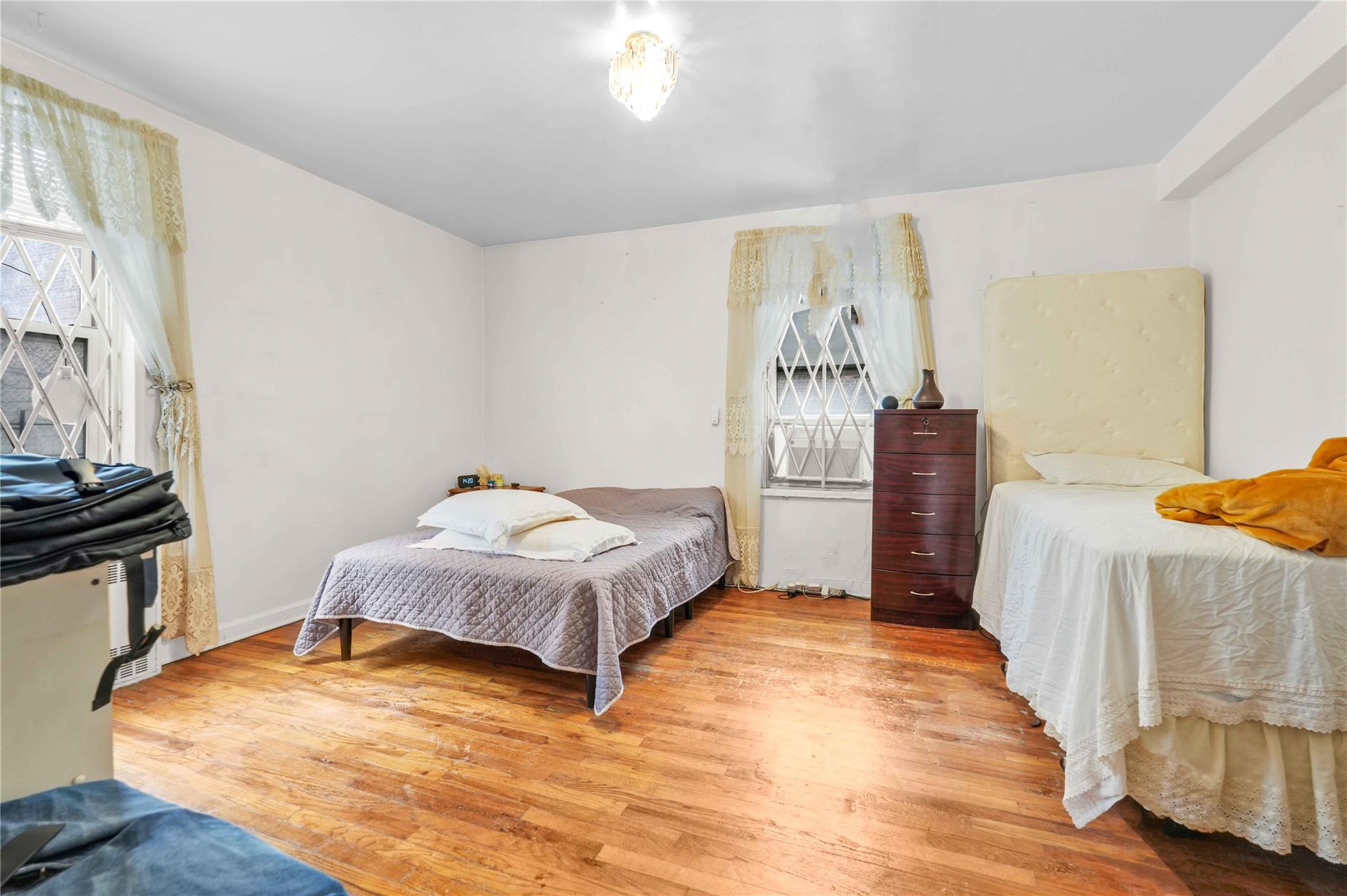 42-25 80th Street, Unit 1F Queens, NY 11373 - Photo 19 of 27 Bedroom with wood finished floors