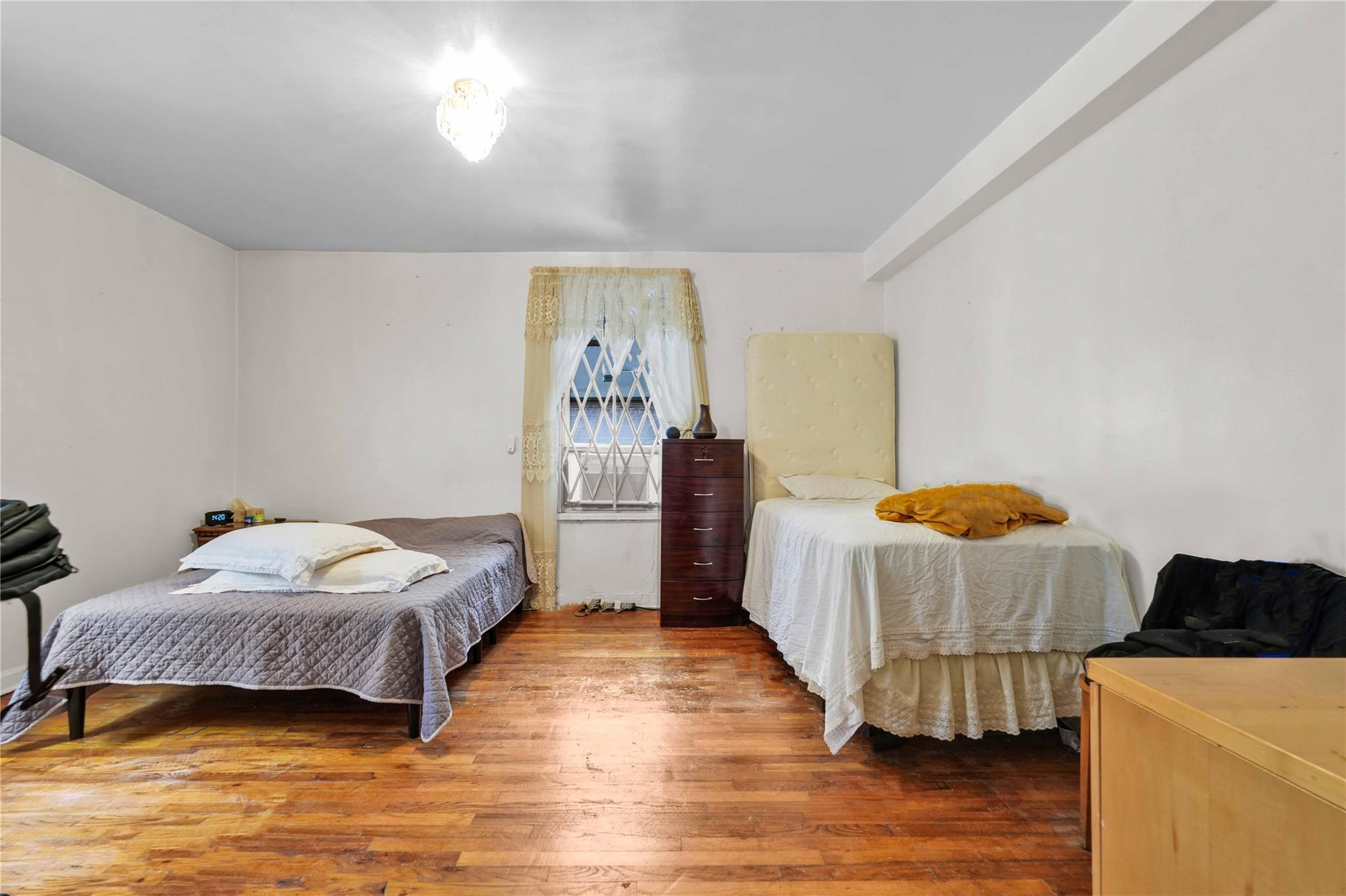 42-25 80th Street, Unit 1F Queens, NY 11373 - Photo 21 of 27 Bedroom with wood finished floors