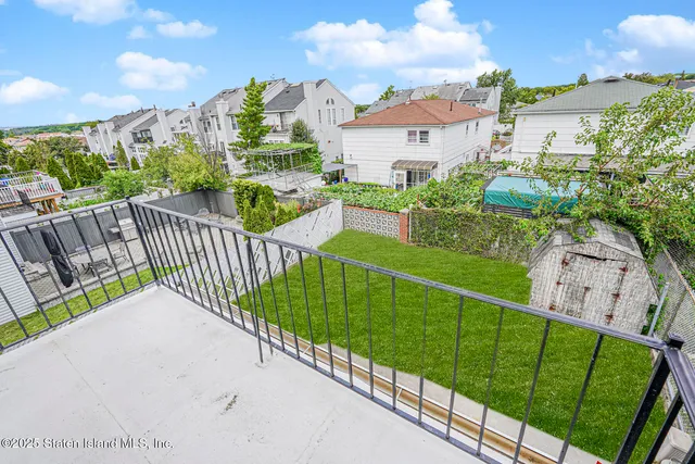 a view of a garden and deck