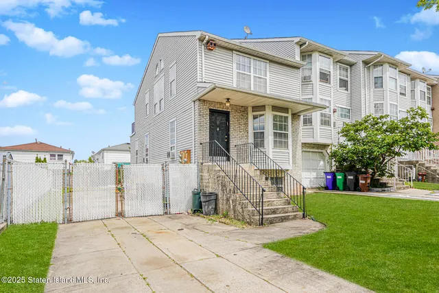 a view of a building with a yard