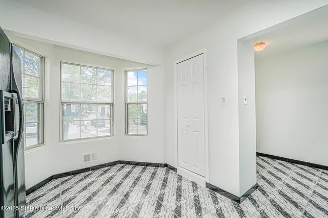 a view of an empty room and window