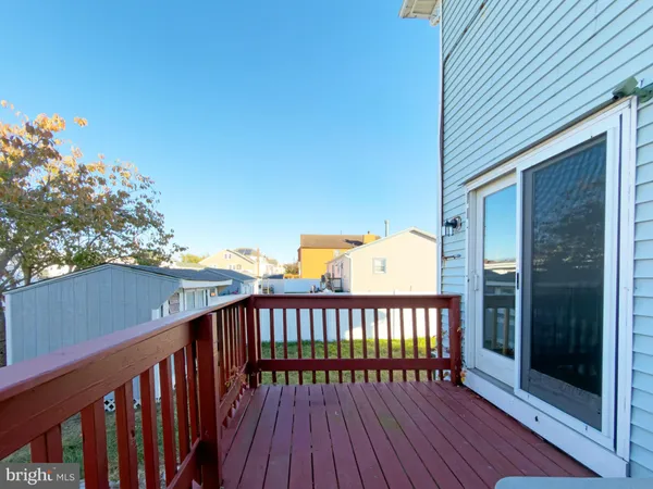a view of a wooden balcony with a potted plant