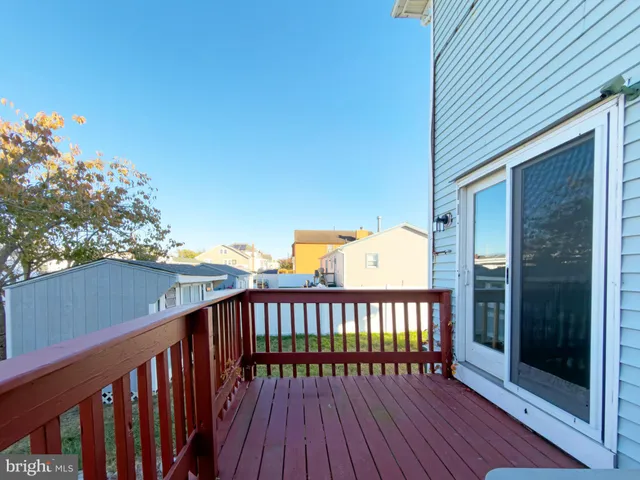 a view of a wooden balcony with a potted plant